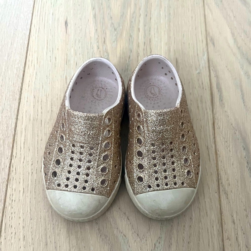 Native Shoes- gold sparkle with beige soles. Size C5 (Baby 5)